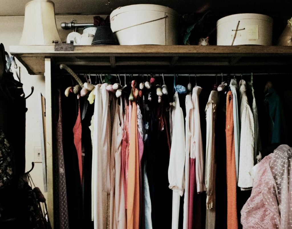 clothes hanged inside wardrobe