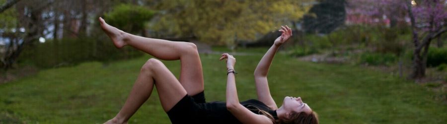 woman back flipping in the garden