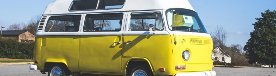 yellow and white volkswagen t-2 van