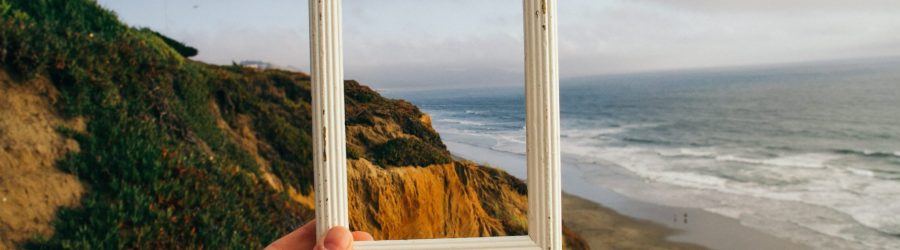 person hand holding photo frame